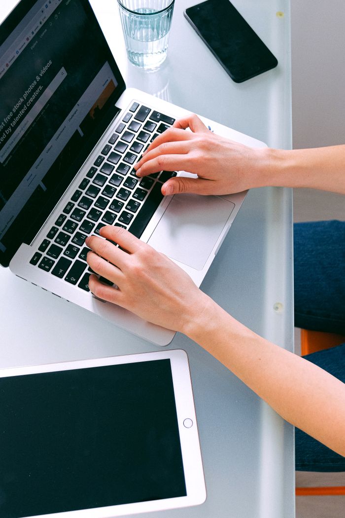 Crafting Captivating Headlines: Your awesome post title goes here An organized home office featuring a laptop and tablet for remote work.